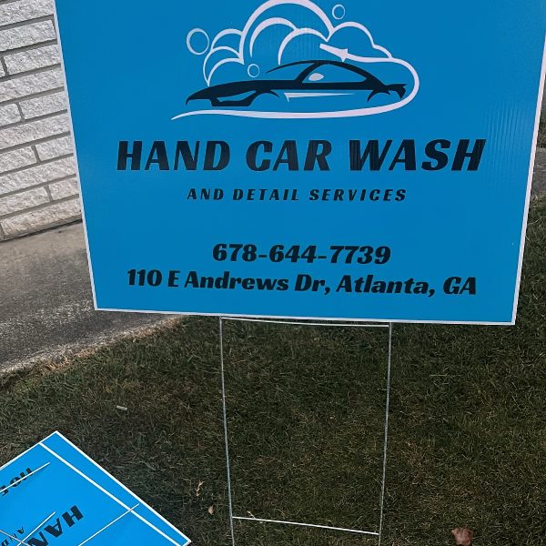 Blue yard sign for a hand car wash