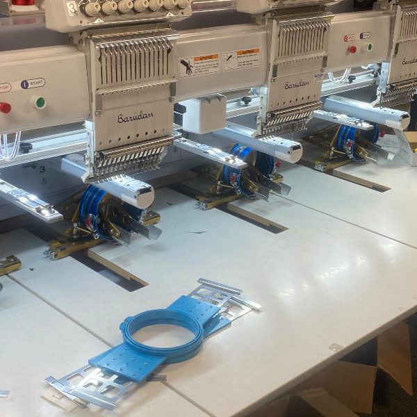 A row of multi-head embroidery machines