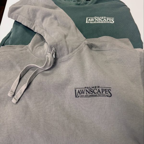 Gray and green hoodies with a lawn and landscape company logo