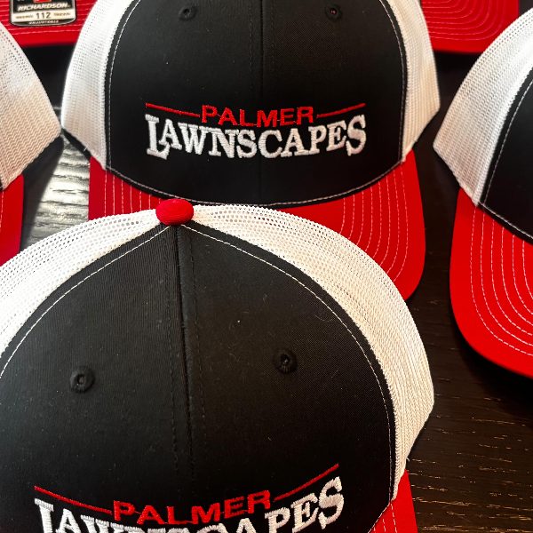 Truckers for a lawn and landscape company