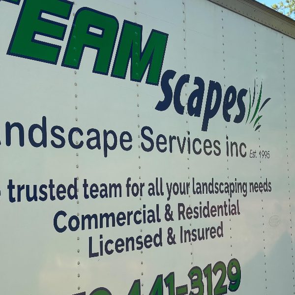 Box truck side lettered for a landscape services company